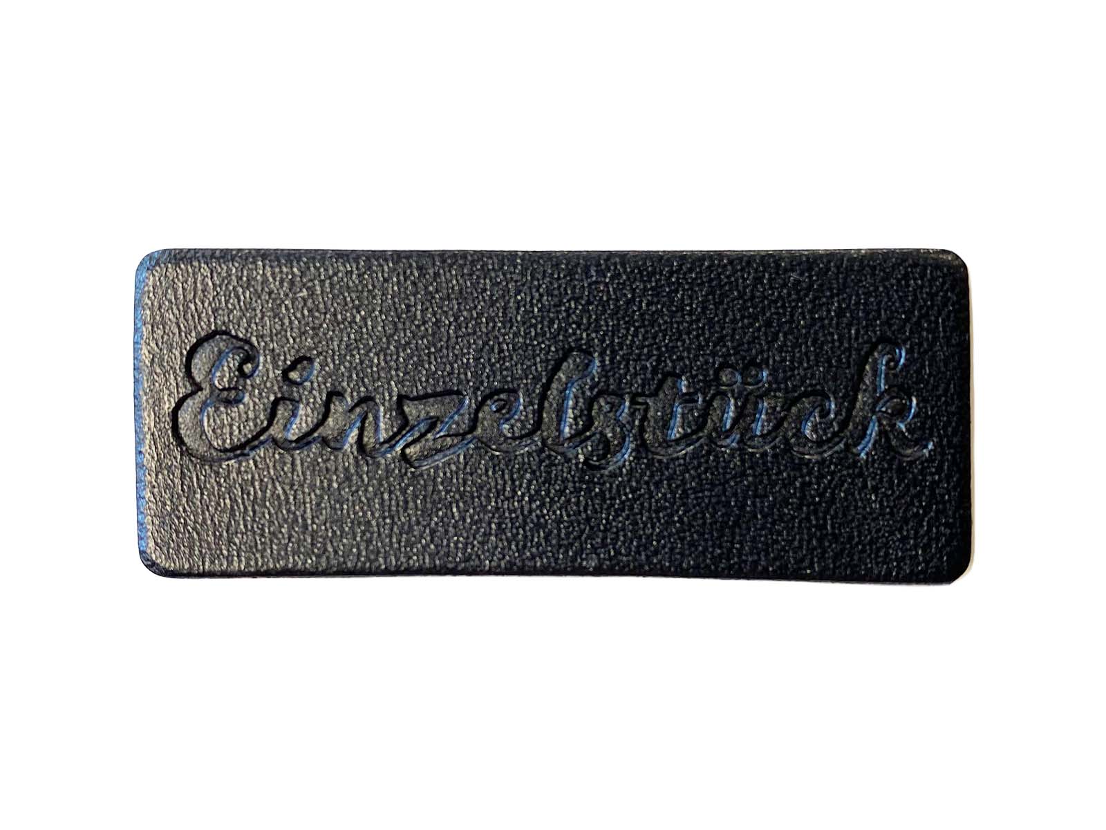 Label aus Kunstleder - "Einzelstück" in schwarz